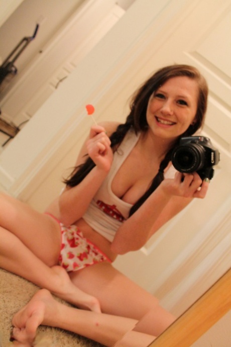 Young amateur Freckles 18 takes self shots while getting naked in a mirror 40899436