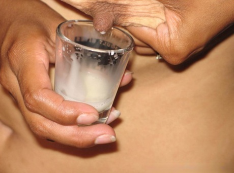 Latina chick fills a shot glass with breast milk before toying her vagina 29889178