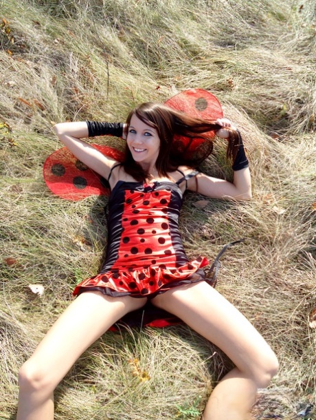 Charming young girl Andi Land exposes her tits while wearing a costume 13418592