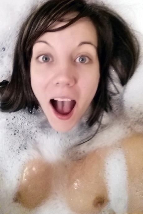 Naked teen Andi Land takes self shots during the course of a bubble bath 42962937