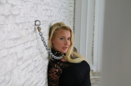 Fully clothed blonde is kept in line with chains and high end handcuffs 85843770