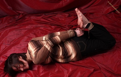 Brunette girl is hogtied while fully clothed and wearing glasses 71943335