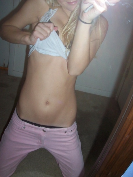 Blonde amateur Kylie takes mirror selfies while disrobing to her bra and thong 57390308