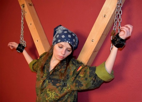 White girl exposes her breasts while cleave gagged and chained in camo 61544014