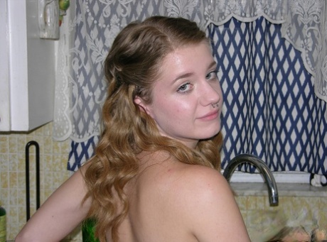 Young looking amateur Dakota B disrobes to go naked around her house 43530064