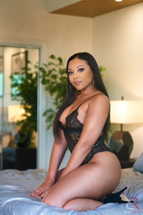 Curvy black beauty Adriana Maya models lingerie on a bed in heels 97617218
