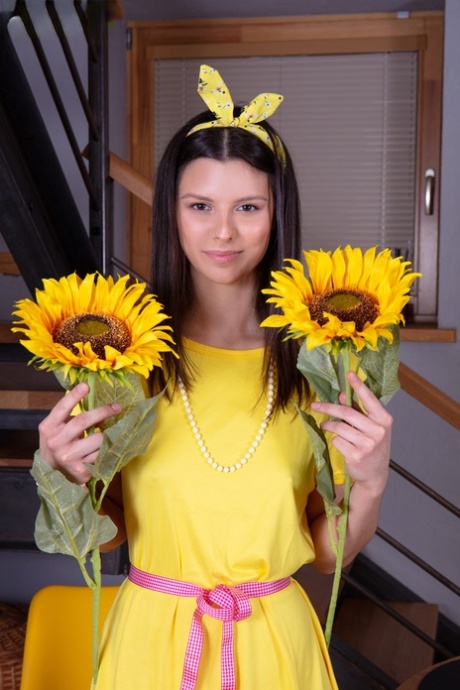Adorable brunette teen Amelia Grace holds sunflowers while getting bare naked 20729953