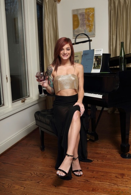 Tattooed redhead Roxy Ryder gets totally naked on a piano bench 81598710