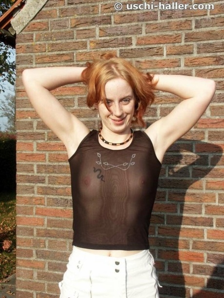 Young redhead shows her tits and pussy in a backyard environment 40335973