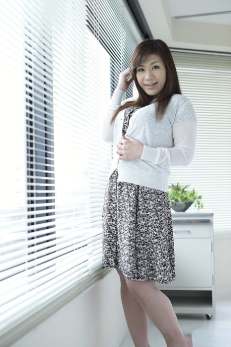 Japanese girl Satomi Katayama unveils her large tits while going nude 80973689
