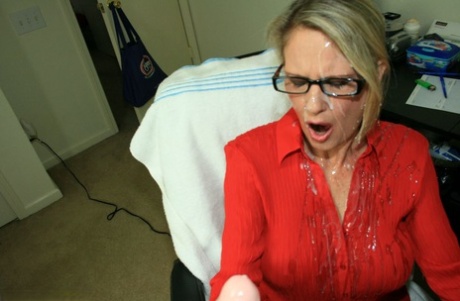 Fully clothed older lady Bridgett Lee takes a massive cumshot during a handjob 29426083