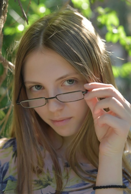 Small titted Catalina in glasses posing naked in a field showing bald muff 80025540