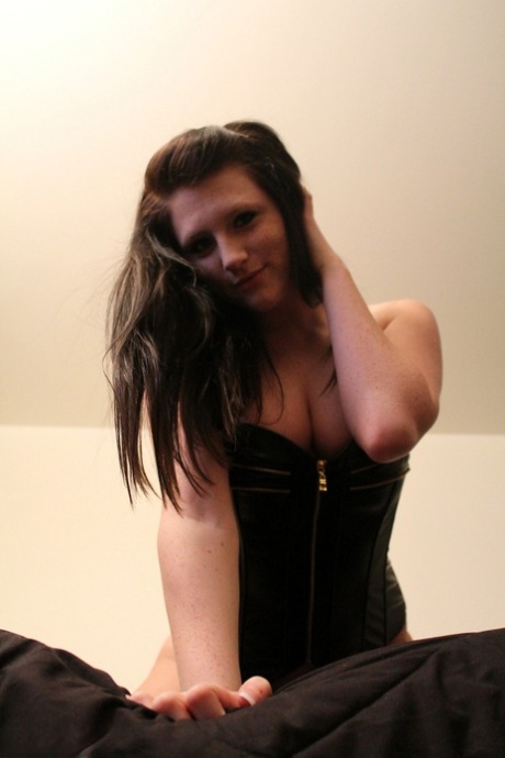 Young amateur Freckles 18 grasps her breasts after removing a leather corset 95408777