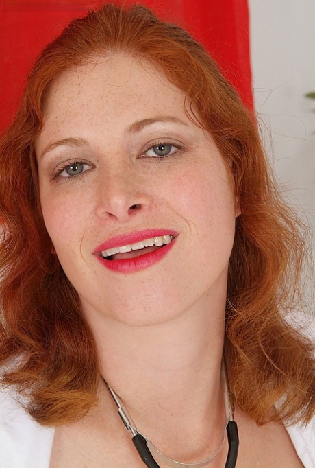MILF redhead nurse undressing off her uniform to tease her wet pussy 19275015