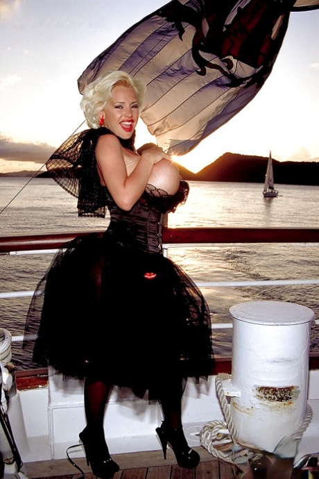 MILF pornstar SaRenna Lee loosing huge boobs from vintage clothes on boat 63542907