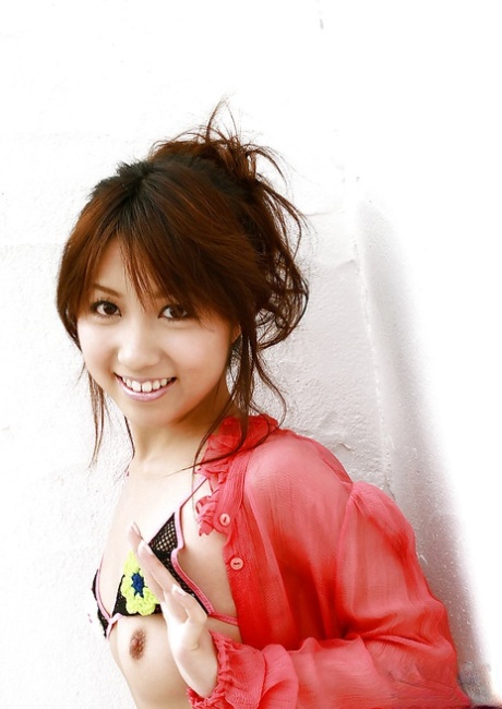 Seductive asian chick Rika Yuuki slipping off her lingerie 31931143