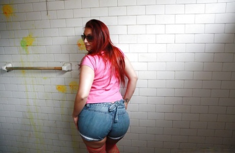 Redhead latina Evelyn Contreras revealing her big ass and inviting pussy